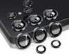 A collection of camera lens protectors for a smartphone, arranged on a dark surface and a white surface. Produktbild-Vorschau