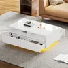 A modern white coffee table with LED lighting is shown in a living room setting, placed on a rug next to a sofa. Náhled obrázku produktu