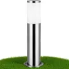 A silver and white outdoor lamp standing on green grass. Produktbild-Vorschau
