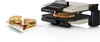 A sandwich maker with two sandwiches on a plate next to it. Podgląd zdjęcia produktu