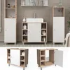 A bathroom vanity unit with a sink and storage cabinets, shown in a staged setting with tiles and some accessories. Náhled obrázku produktu