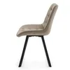 A side view of a single upholstered chair with a tufted back and seat, on a white background. Podgląd zdjęcia produktu