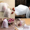 A collage of images showing empty tea bags filled with dried rose buds, some in a bowl, some in a glass of water, and a stack of empty tea bags. Produktbild-Vorschau
