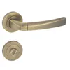 A door handle set with a round rosette and a lever handle, both in a bronze finish, is presented against a white background. Produktbild-Vorschau