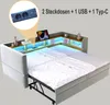 A daybed with an extended sleeping surface, featuring integrated shelving and LED lighting, with a close-up inset of the power outlets. Náhled obrázku produktu
