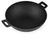 A black cast iron wok-grill pan is shown from a slightly elevated diagonal angle against a white background. Podgląd zdjęcia produktu