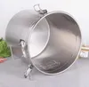 A stainless steel canister is shown from a slightly elevated angle, with its lid open. Produktbild-Vorschau