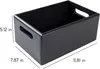 A black wooden storage box with cut-out handles is shown from a slightly elevated side angle. Dimensions are indicated with white text and lines. Produktbild-Vorschau