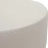 A close-up view of the top edge of a round, cream-colored ottoman or stool, showing the stitching detail. Náhľad obrázku produktu