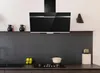 A modern kitchen with a black glass range hood mounted above a stovetop. Produktbild-Vorschau