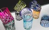 A collection of colorful crystal tumblers stacked and arranged on a white surface with a black background. Produktbild-Vorschau