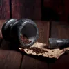 A marble mortar and pestle with peppercorns on a wooden surface. Voir les images du produit