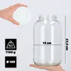 A hand holds a white lid above a large, empty glass jar. Dimensions and weight information are displayed in graphic icons. Podgląd zdjęcia produktu