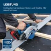 A person is using a cordless circular saw on a construction site, cutting through wood. Produktbild-Vorschau