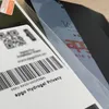 A close-up view of a product packaging with a phone screen visible. Produktbild-Vorschau
