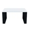 A white coffee table with black legs on a white background. Produktbild-Vorschau
