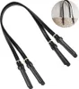 A pair of black leather bag handles with gold buckles, shown against a white background. Produktbild-Vorschau