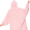 A person wearing a pink hoodie blanket, viewed from the back. Produktbild-Vorschau