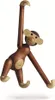 A wooden monkey toy is hanging against a white background. Náhled obrázku produktu