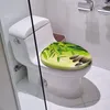 A toilet with a decorative seat cover featuring a bamboo and stone design. Produktbild-Vorschau