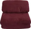A close-up view of a burgundy sofa bed. Podgląd zdjęcia produktu