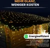 Christmas lights on a roof and house. Produktbild-Vorschau