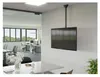 A modern office space with a TV mounted on the wall using a ceiling mount. Podgląd zdjęcia produktu