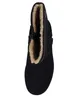 A top-down view of a black boot with tan fur lining. Anteprima dell’immagine prodotto