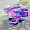 A child wearing a helmet is blurred in the background, while a colorful bicycle helmet is in the foreground with motion lines suggesting airflow. Anteprima dell’immagine prodotto