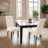 A dining room with a marble-topped table and two cream upholstered chairs. Produktbild-Vorschau