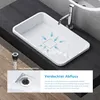 A white rectangular sink with a chrome faucet is shown on a dark countertop. Blue arrows indicate water flow towards the drain. A close-up of the drain and a separate drain assembly are also visible. Produktbild-Vorschau
