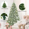 A family is gathered around a decorated Christmas tree in a living room setting. Náhled obrázku produktu