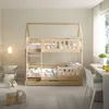 A wooden bunk bed with a drawer, set up in a child's room with toys on the floor. Produktbild-Vorschau