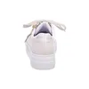A back view of a beige platform sneaker with white laces and a white sole. Náhled obrázku produktu