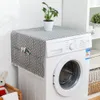 A washing machine with a decorative cover on top, placed in a laundry room or bathroom. Podgląd zdjęcia produktu