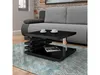 A modern living room scene with a black high-gloss coffee table in the foreground, placed on a patterned rug in front of a gray sofa. Náhled obrázku produktu
