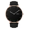 A close-up studio shot of a minimalist smartwatch with a black dial and gold casing. Podgląd zdjęcia produktu
