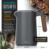 A close-up marketing image of a gray electric kettle with a wooden-look handle, featuring product specifications and a woman relaxing in the background. Produktbild-Vorschau