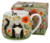 A mug with a cat design and its accompanying gift box. Anteprima dell’immagine prodotto