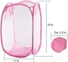 A pink pop-up laundry basket is shown in its open and folded states, with dimensions indicated. Produktbild-Vorschau