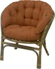 A brown cushion on a rattan chair. Produktbild-Vorschau