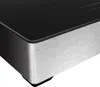 A close-up view of the corner of a black and silver induction cooktop. Anteprima dell’immagine prodotto