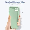 A hand holding a light green phone case against a light background. Produktbild-Vorschau