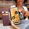 A person is using a phone with a wallet case to make a payment at a terminal. Produktbild-Vorschau