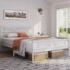 A bedroom scene with a white metal bed frame, bedding, and decorative elements. Produktbild-Vorschau