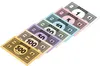 A collection of Monopoly money bills of various denominations arranged diagonally on a white background. Produktbild-Vorschau