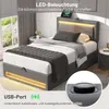A modern bedroom setting featuring a grey upholstered bed with LED lighting and a built-in USB port. Náhľad obrázku produktu