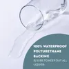 A glass of water is tipped over on a white surface, demonstrating its waterproof quality. Produktbild-Vorschau