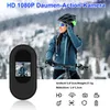 A woman in cycling gear holding a small black action camera. Produktbild-Vorschau