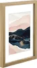A framed picture of a landscape with mountains. Produktbild-Vorschau